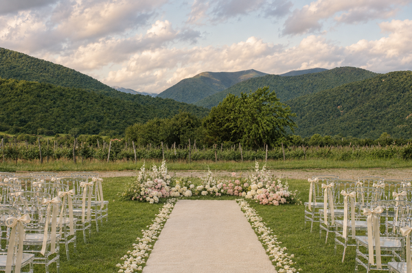 Wedding aisle overlooking a vineyard and mountains