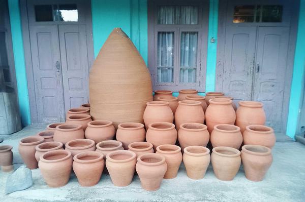 Freshly made Qvevri clay vessels displayed at a traditional pottery house in Guria, Georgia