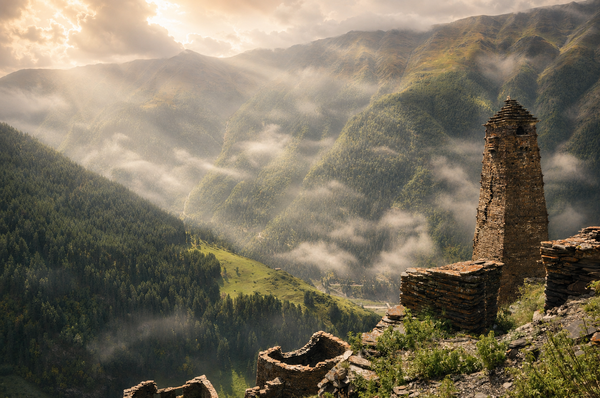 An ancient Tusheti tower rising above the misty valleys of the Caucasus Mountains.