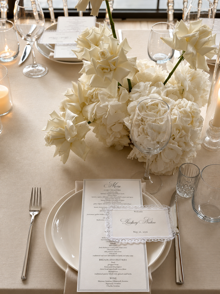 Wedding table setting with white floral decor