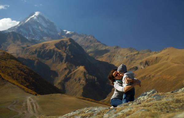 Family in the Kazbagi Mountains, Mt Kazbek on Background